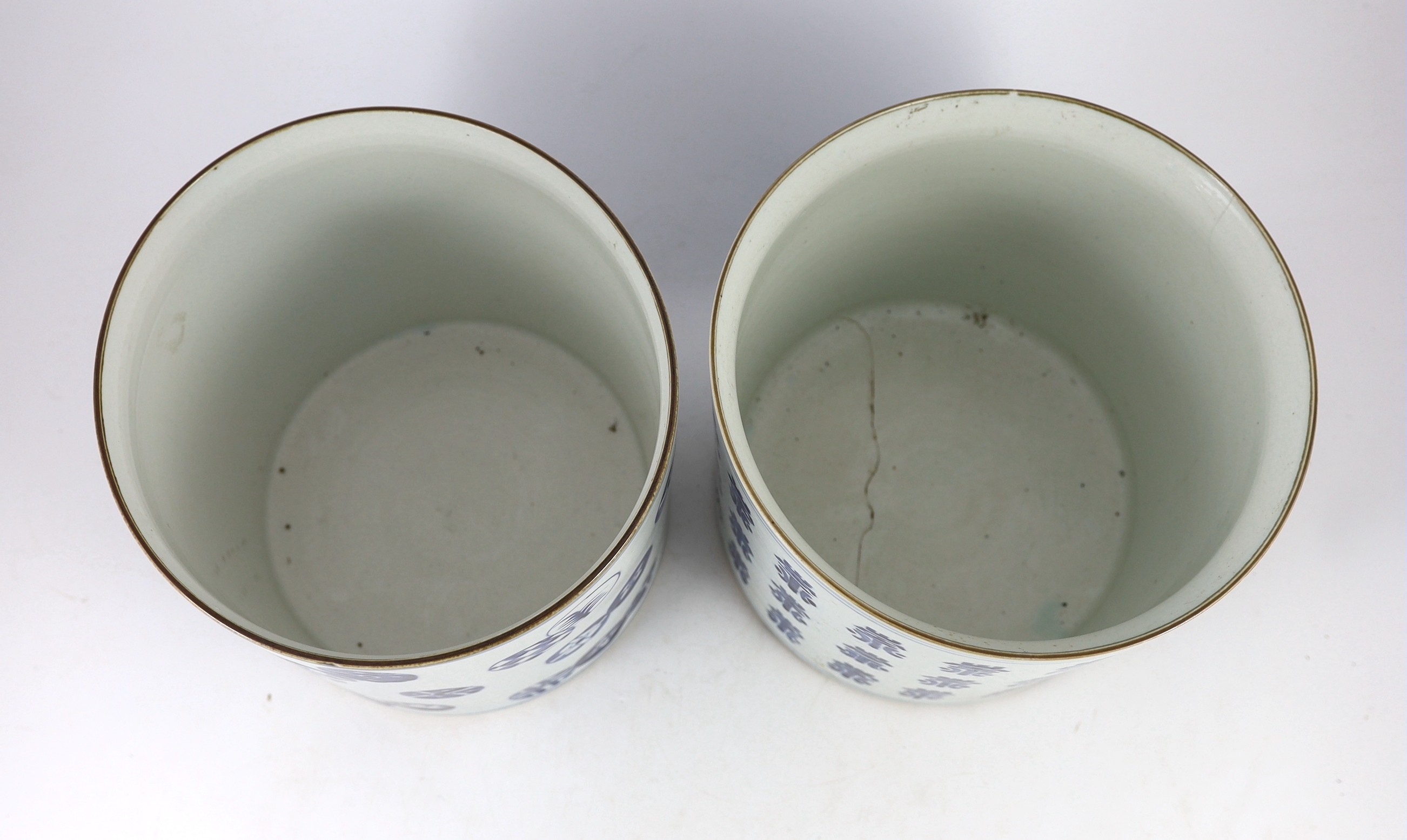 A pair of large Chinese blue and white brushpots, late 19th century 25 cm diameter, one cracked